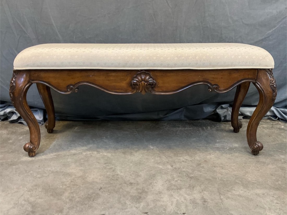 Chippendale Bench: Late twentieth century Chippendale style upholstered bench. Stains to upholstery. Cushion/ seat not affixed to bench frame. Measures 44 inches wide x 15 x 19.5 inches tall.
