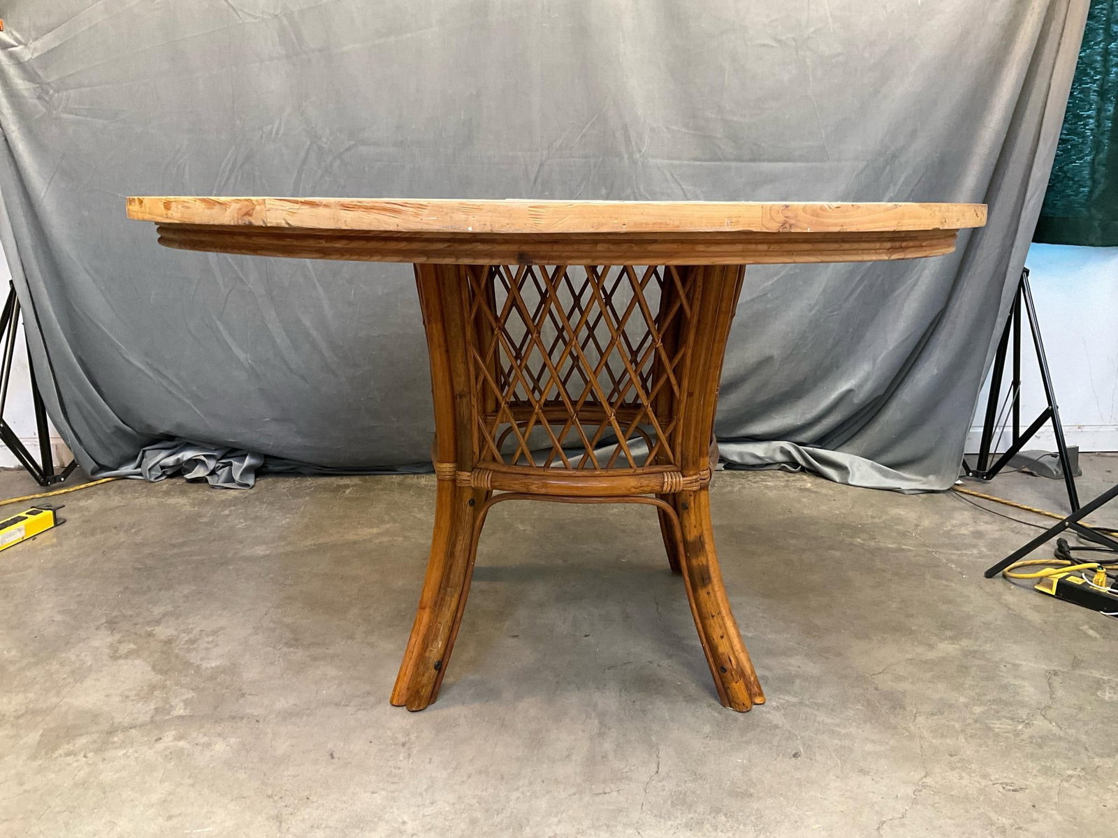 Tiled Wicker Table: Contemporary late twentieth century circular tiled table with wicker base. Stains to top, otherwise good condition. Measures 50 inches in diameter x 29.5 inches tall.