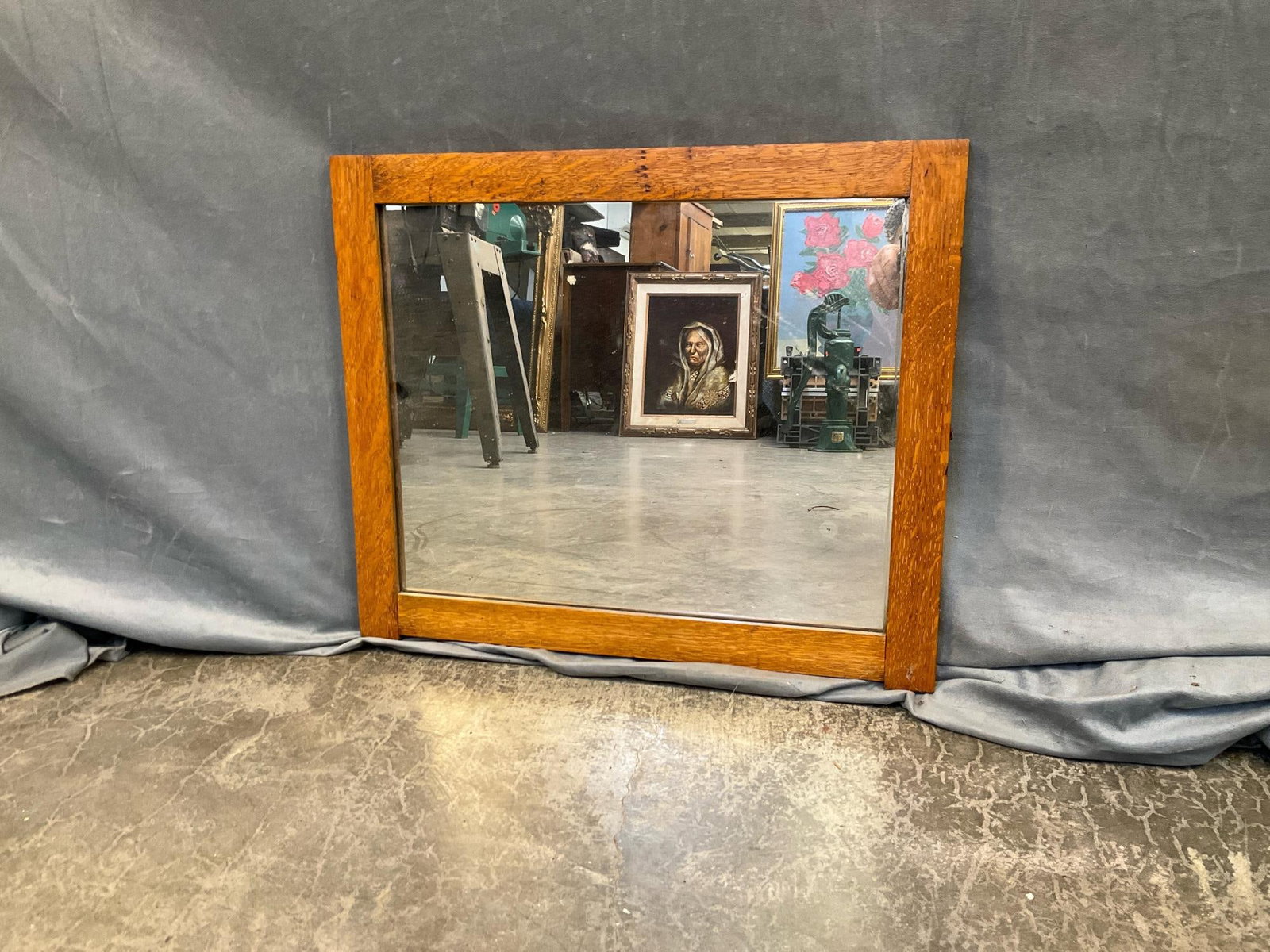 Oak Mirror: Early 20th century oak mirror. Originally part of a wash stand, otherwise good condition. Measures 22.75 inches wide x .75 x 19 inches tall.