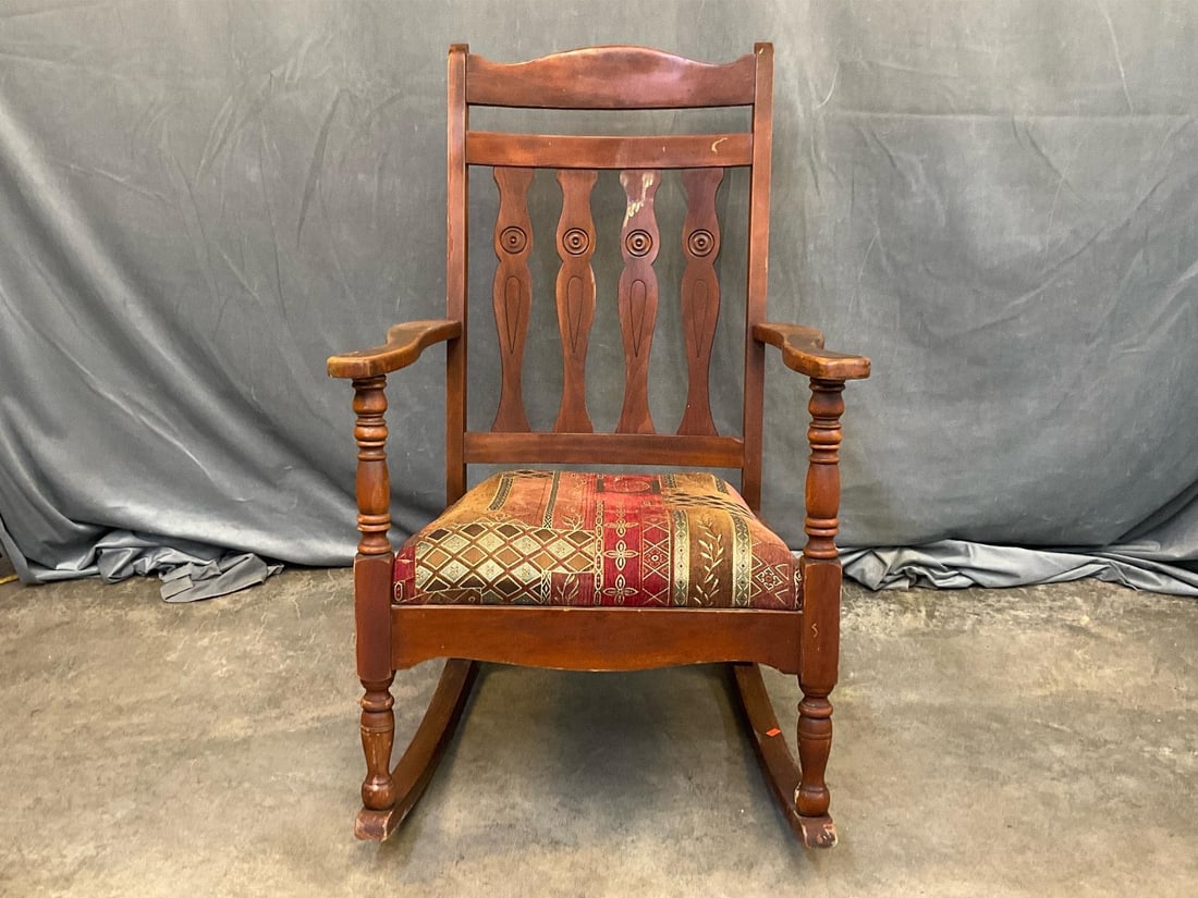 Rocking Chair: Mid-20th century rocking chair with upholstered seat. Some scratches and discoloration to finish, otherwise good condition. Measures 24 inches wide x 31.5 x 38.5 inches tall.