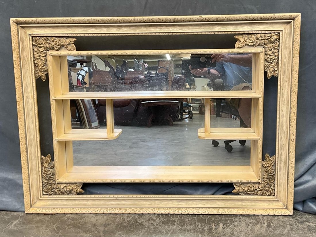 Curio Display: MCM Shadow Box Curio Display with mirror and floral corner decorations. Good condition. Measures 42.25 inches wide x 5 x 30.5 inches tall.