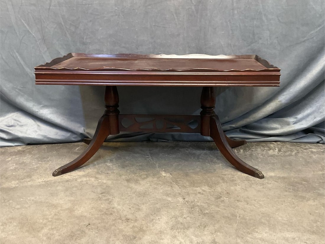 Coffee Table: Mid - twentieth century mahogany Duncan Phyfe Style coffee table. Old finish with spots to top, otherwise good condition. Measures 35.5 inches wide x 18.5 x 17 inches tall.