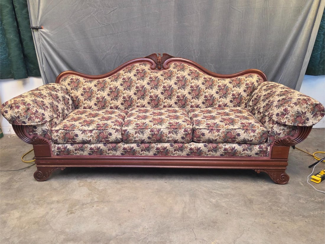 Sofa: Mid-twentieth century Empire floral upholstered sofa with carved Federal eagle to crest rail. Used condition with upholstery in good condition. Measures 88 inches wide x 33 x 36 inches tall.