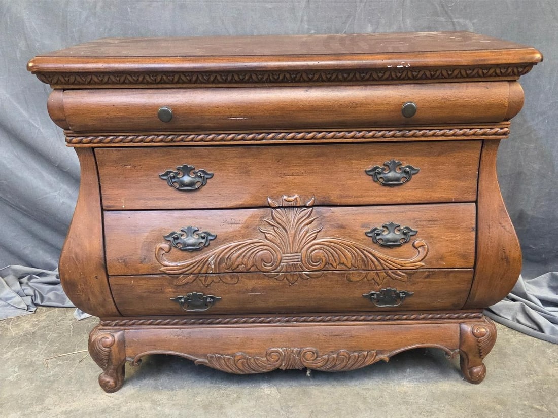 Chest of Drawers: Late 20th century Louis XV Style chest of four drawers with central carving to drawers. Some white paint spots to finish, otherwise good condition. Measures 37 inches wide x 17.5 × 30 inches tall.