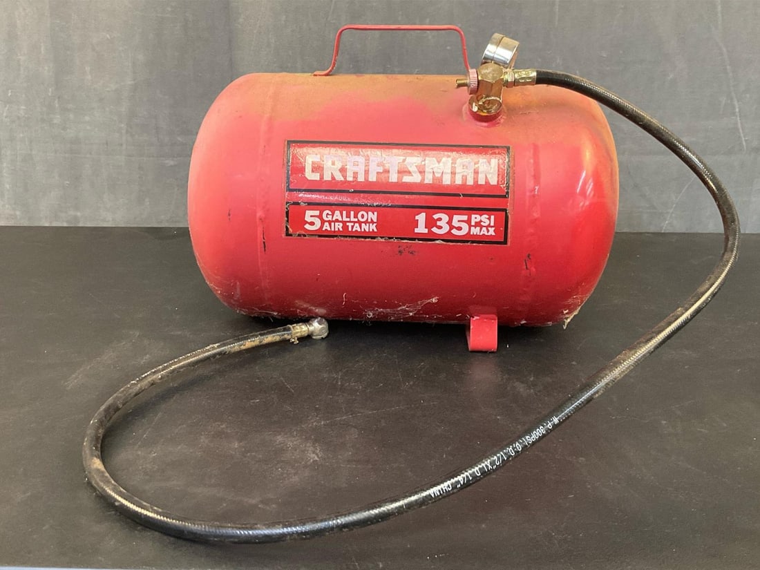 Air Tank: Early 2000 Craftsman five gallon air tank. 135 PSI Max. Not tested. Measures 15 inches wide x 8.5 x 12 inches tall.