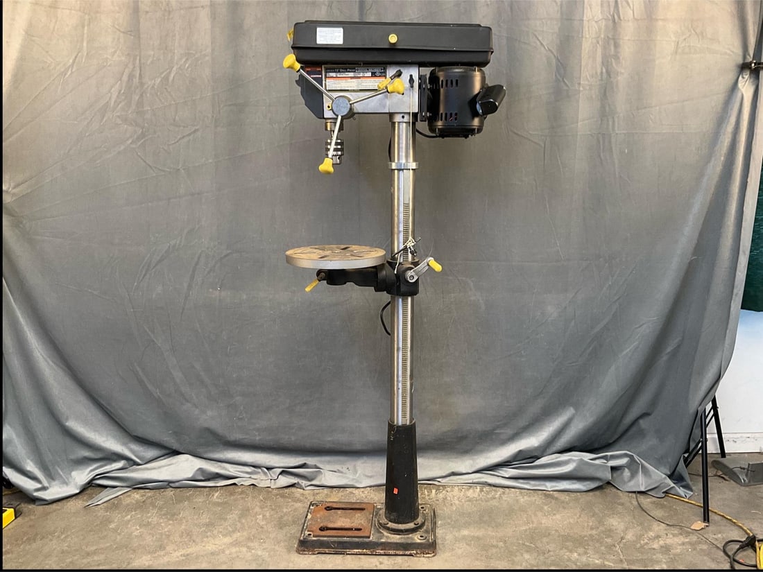 Drill Press: 2012 Central Machinery 13" Drill Press. See picture for specifications. Powers on, appears to function. Measures 27 inches wide x 12 x 63 inches tall.