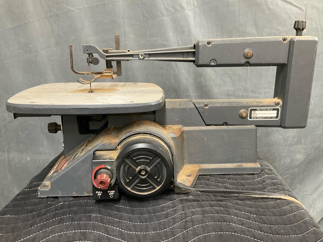 Scroll Saw: 1980's Sears/Craftsman 16-in. Variable Speed Scroll Saw. Powers on, not tested. Measures 24 inches wide x 12 x 13 inches tall.