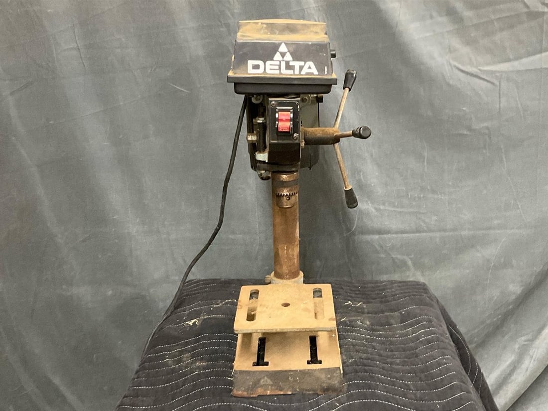Drill Press: 1980's Delta Drill Press. Powers on, not tested. Measures 17 inches wide x 8 x 23.5 inches tall.