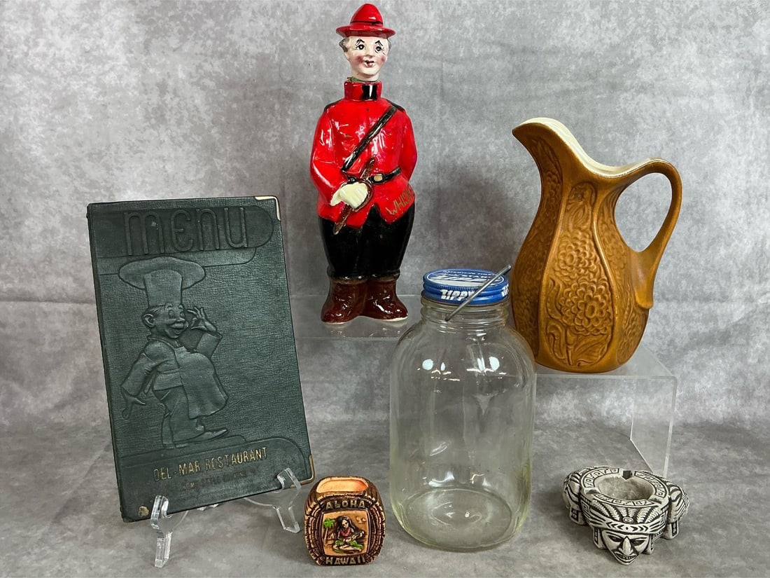 Assorted Decor: Six mid 1900's collectibles. Royal Canadian character whiskey decanter, McCoy pottery gold textured pitcher, and Zippy liquid starch jar with lid and wire handle. Includes 1930-1940's Menu from Del-Ma