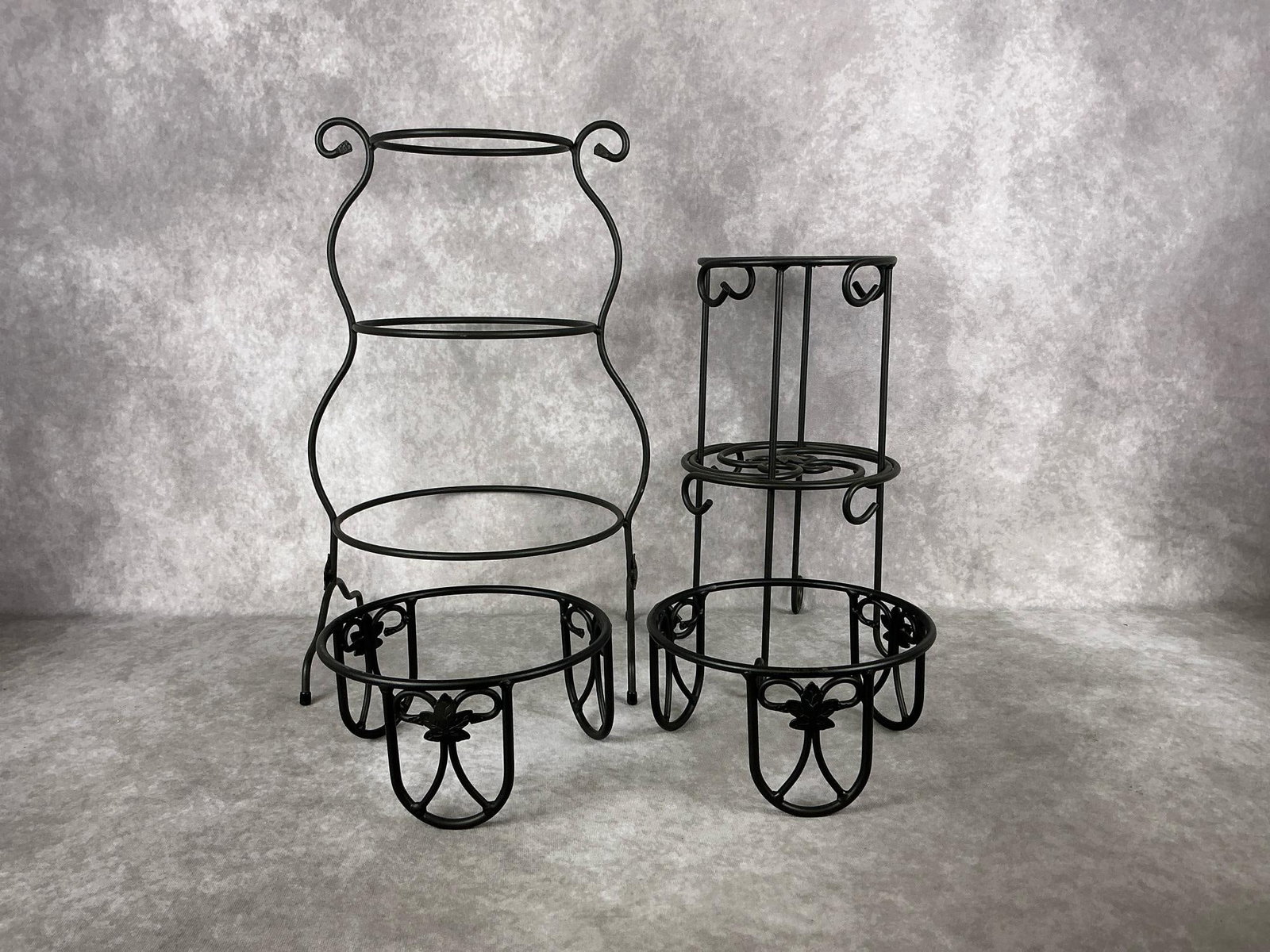 Longaberger Stands: Four wrought iron Longaberger pieces including a three tiered mixing bowl stand, a mug tree, and two plant stands. All in good condition. Largest measures 11.75 inches wide x 10 x 18.5 inches tall.