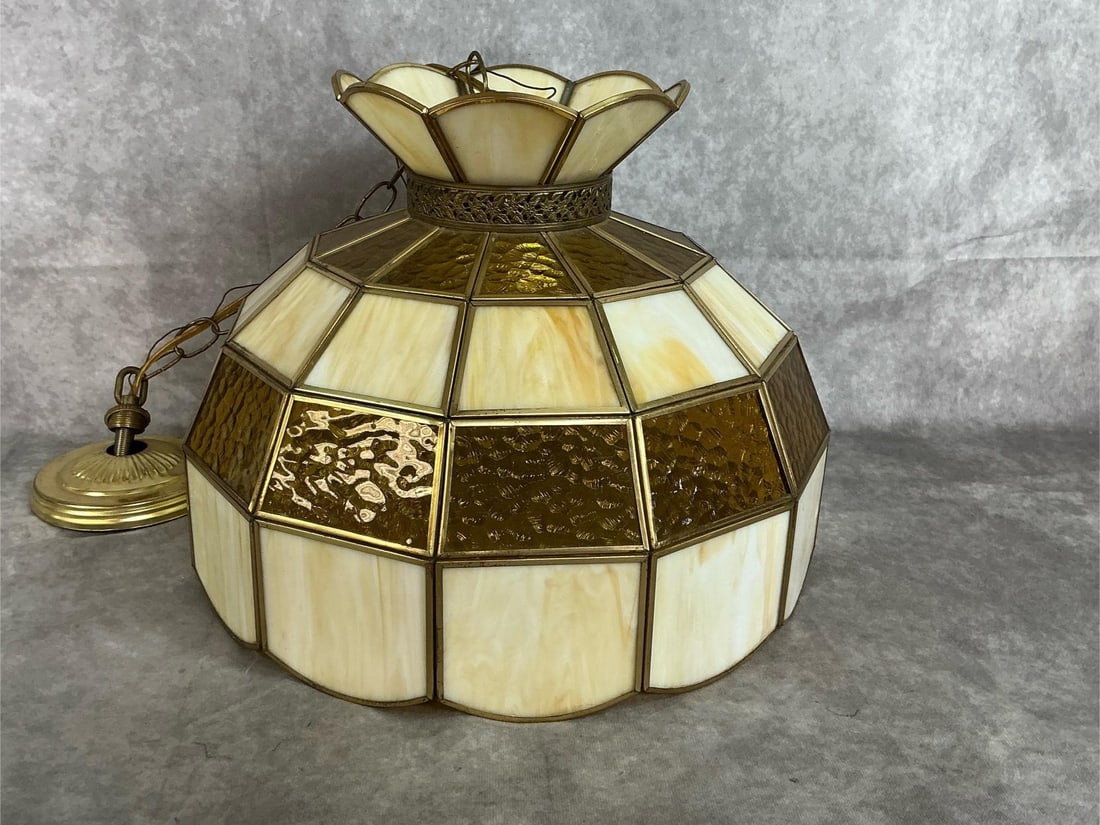 Stained Glass Swag Light: Late 1900's amber and carmel slag glass handcrafted light. Tiffany style with hanging chain. In good condition. Measures 15 inches in diameter x 12 inches tall.