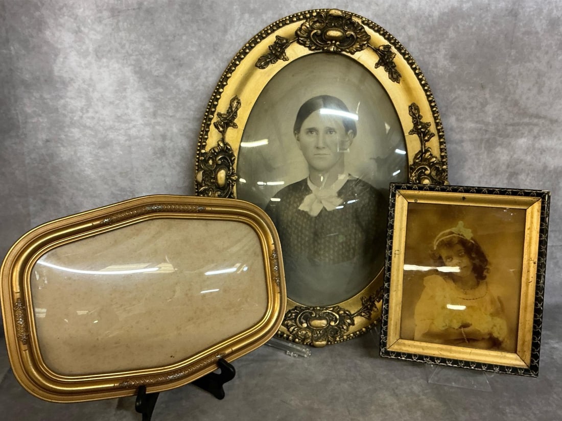 Antique Frames & Pictures: Three late 1800's frames and pictures. Ornate gold tone oval frame with lady in period dress and style. Young girl holding flowers in black and gold square frame and ornate oval frame without