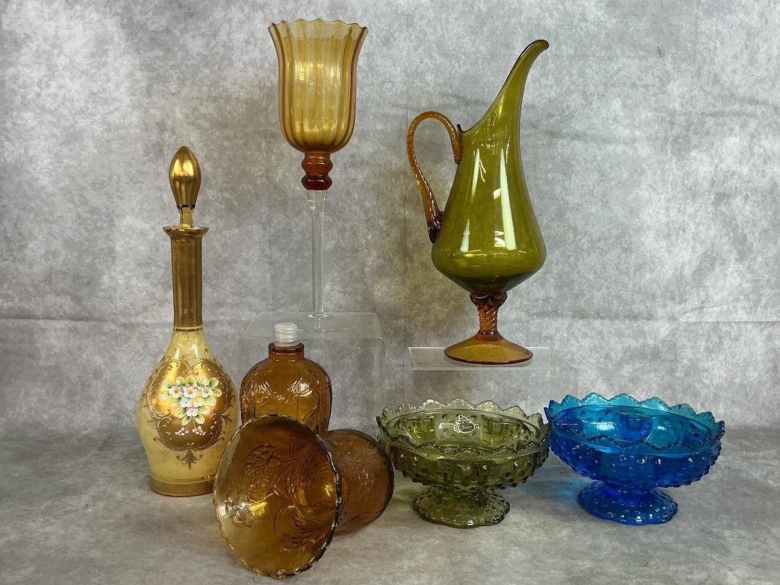 Collectible Fenton Glass & Amber Glass: Seven mid 1900's glass pieces. Empoli style olive glass pitcher, green and blue Fenton hobnail candle bowls, amber glass sconce peg candle holders, and standing amber candle holder. Includes Bohemian