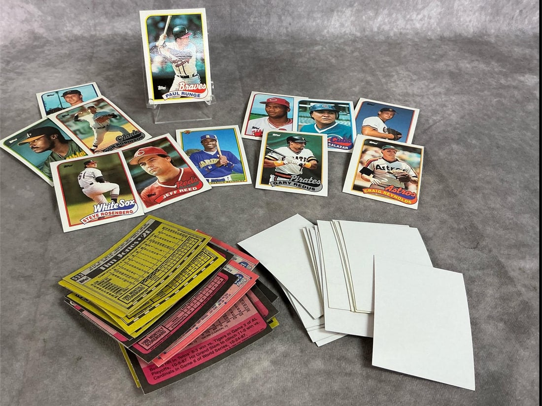 Error Baseball Cards: Fifty 1987-1991 Topps baseball cards. Twelve have incorrect backs with other players information and 38 have blank fronts. Box measures 4.75 inches wide x 3.25 x 2.75 inches tall.