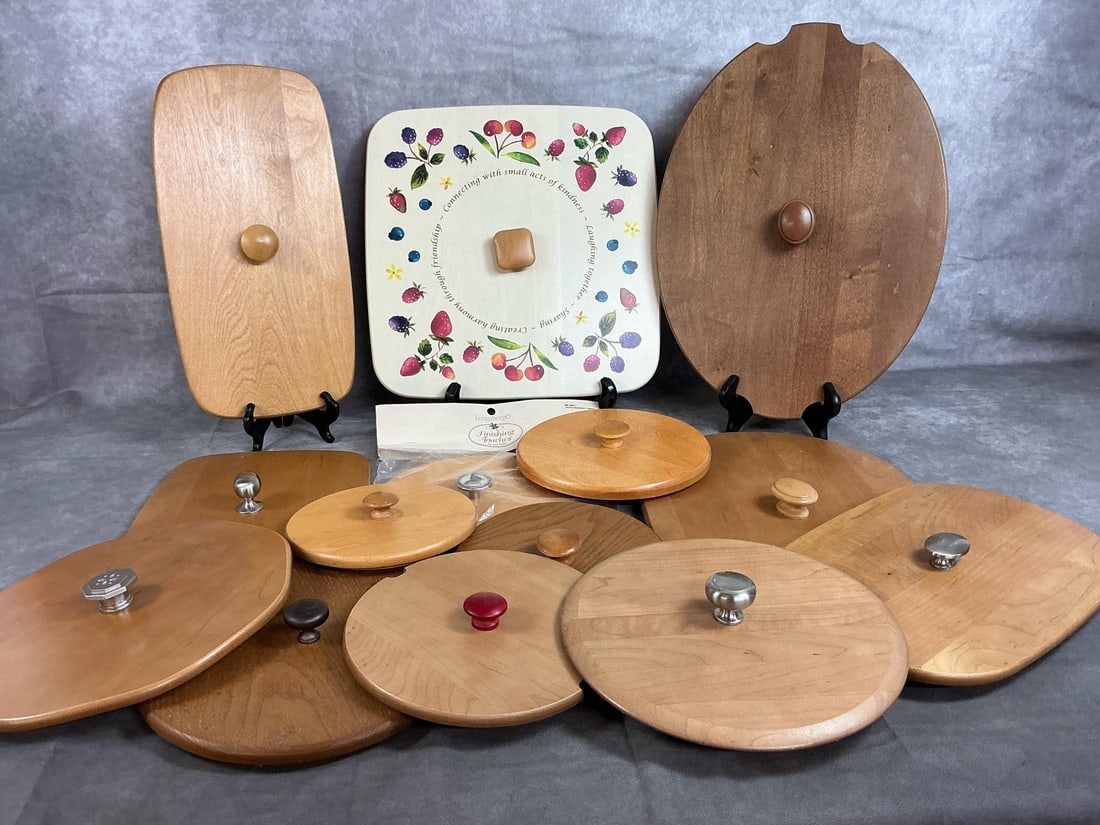 Longaberger Basket Lids: Fourteen Longaberger Finishing Touches wooden lids. Varied sizes and shapes with wooden or pewter knobs. Painted lid with berries, packaged lid has painted butterfly knob. A couple have small nicks,