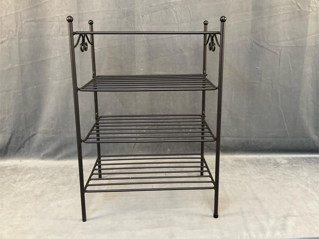 Metal Stand: Early 20th century metal four shelf stand with two removable shelves. Good condition. Measures 18 inches wide x 13 x 26 inches tall.