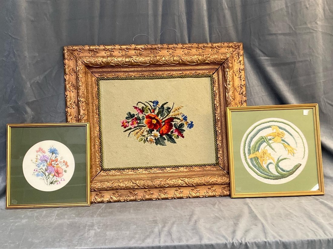 Framed Needlepoints: Lot of three late 20th century framed floral needlepoint works. Good condition. Largest work measures 30 inches wide x 1.5 x 26 inches tall.