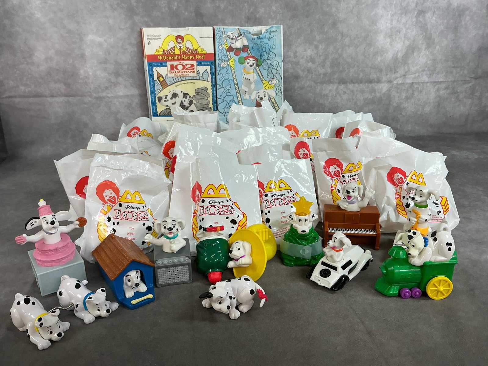 Happy Meal "102 Dalmatians": Forty-two 2000 year "102 Dalmatians" McDonald's Happy Meal Toys. Large assortment of Dalmatian figures, some Christmas theme. Average package measures 5 inches wide x 5 inches tall.