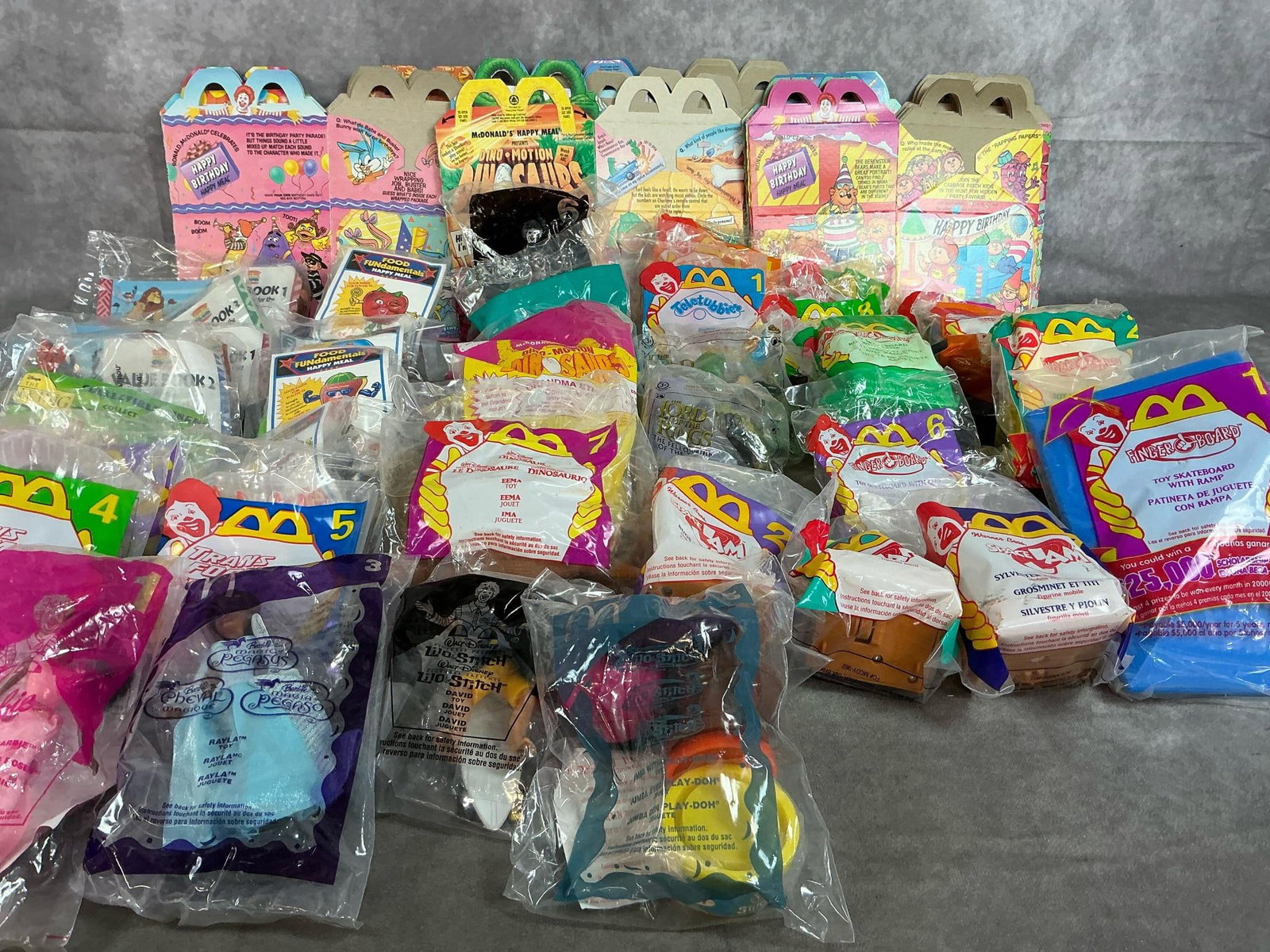 McDonald's & Burger King Toys: 1992-2004 Happy Meal and Burger King toys. Lion King from Burger King and McDonald's toys includes Finger Board, Dinosaurs, Lord of the Rings, Transformers and more. Meal boxes included. Average size