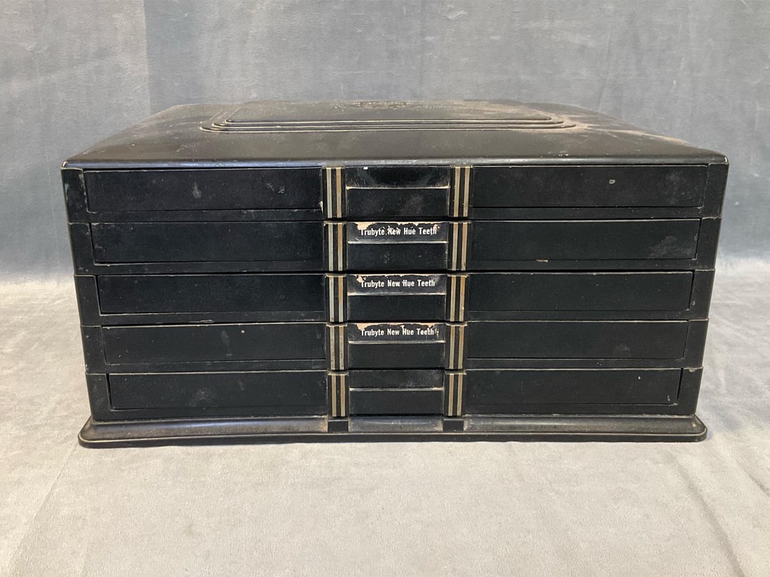 Dentist Cabinet: Early 20th century Art Deco Style Bakelite dental storage cabinet with five slide out trays. "Dental Supply Company of New York " company logo to top. Good condition. Measures 15.25 inches wide x