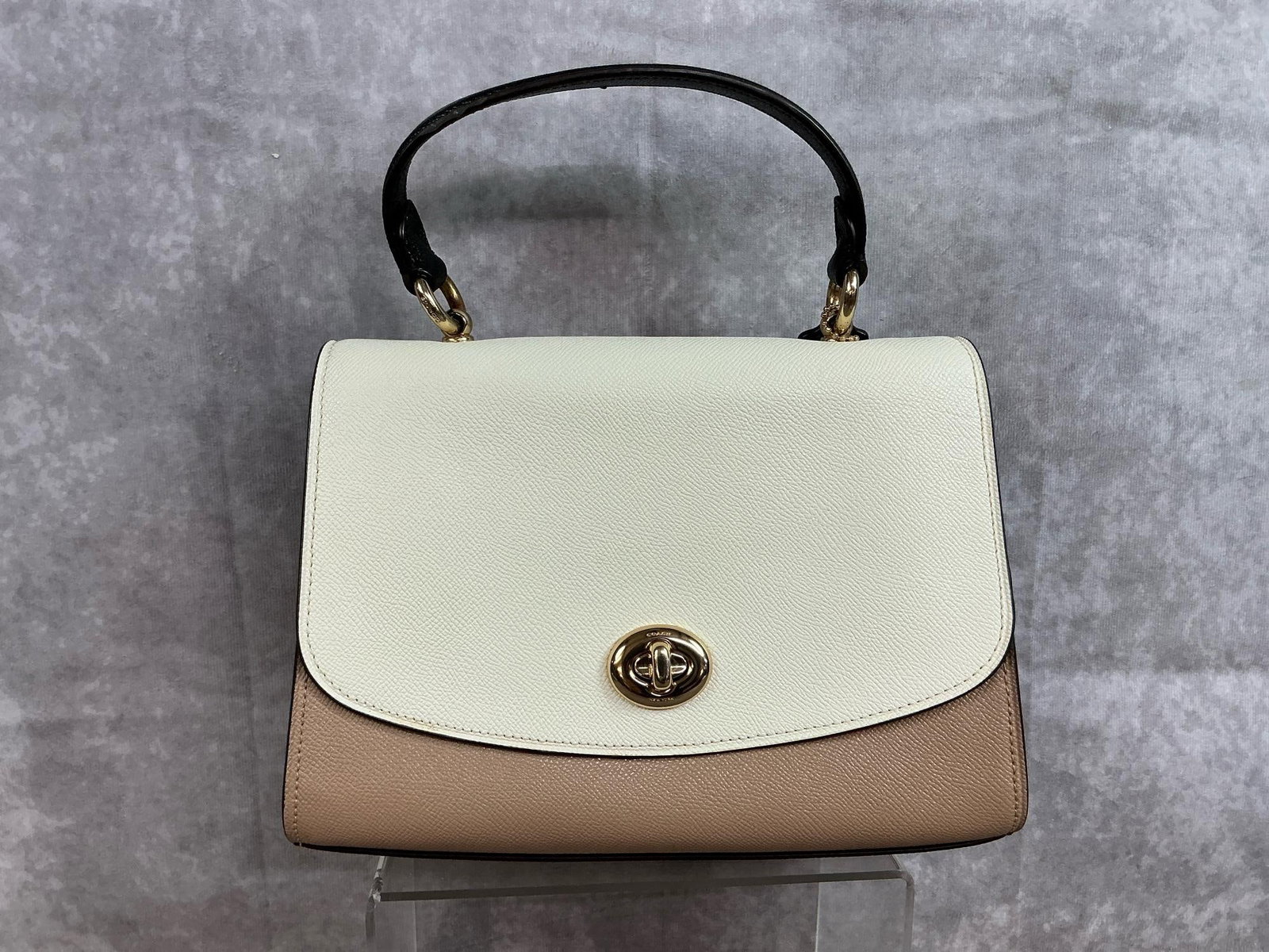 Coach Tilly Top Handbag: 2019 leather Coach Tilly Top handbag with black leather handle and brass colored hardware. Pebbled leather exterior, soft shade leather interior, one outer pocket, one zippered interior pocket, and
