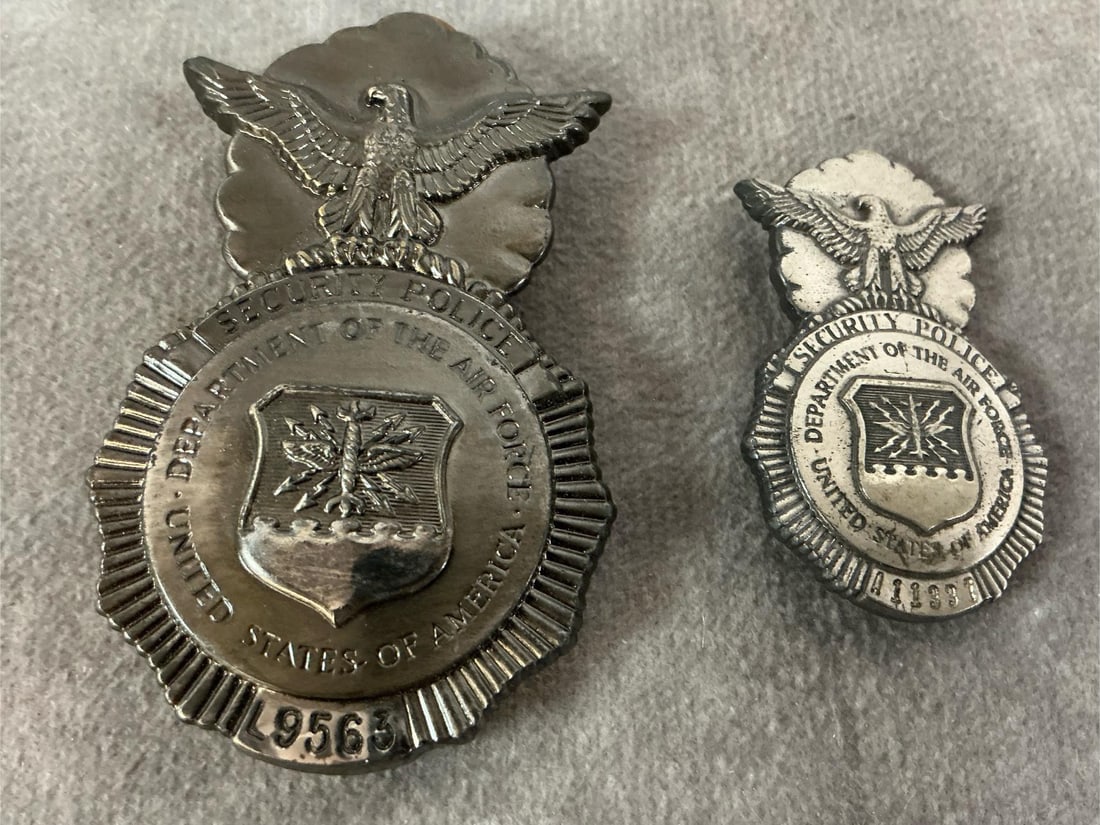 Air Force Security Police Badges: Two vintage badges. Security Police for the Dept of the Air Force badges in two sizes. In good condition. Largest measures 1.5 inches wide x 2.5 inches tall.
