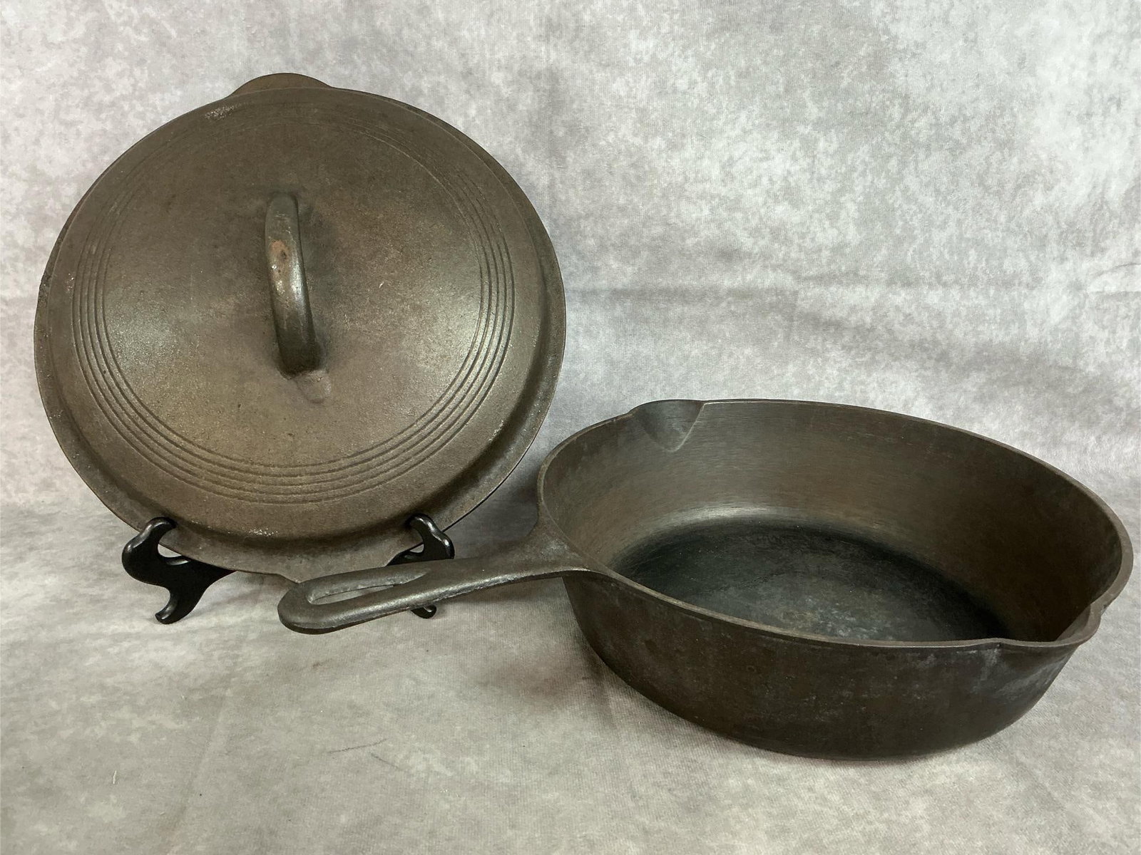 Cast Iron Chicken Fryer & Lid: Vintage cast iron skillet and lid. Heavy "chicken fryer" skillet. Slight signs of rust, otherwise in good condition. Skillet and lid 11 inches in diameter x 3 inches tall or 5 inches tall with lid.