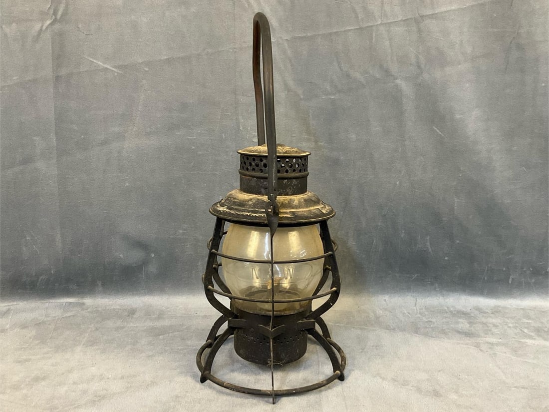 Railroad Lantern: Early 20th century Norfolk and Western Adlake Reliable Railroad Kerosene Lantern with original glass globe with embossed "N&W”. Last patent date "1913”. Good condition. Measures 7.25