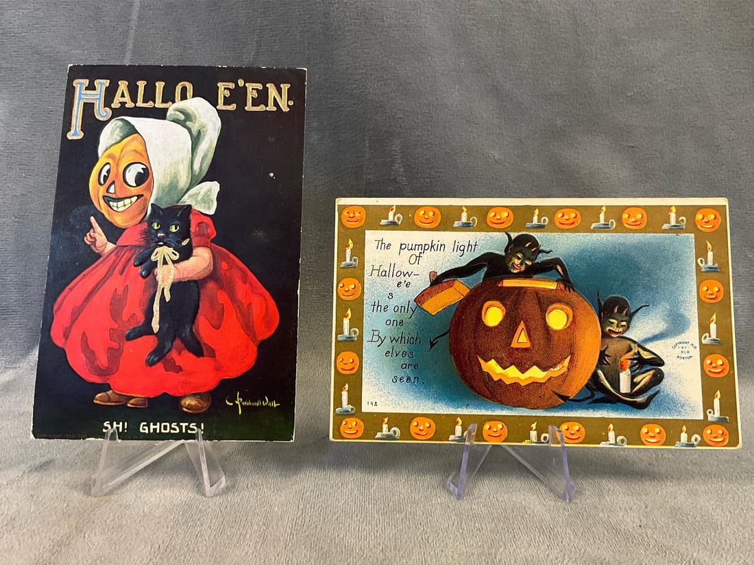 Halloween Postcards: Two 1910 collectible Halloween postcards. One "HALLO E'EN” card by artist Bernhardt Wall. One card by H.I.R. Boston depicting a pumpkin and elves. Circulated, otherwise good condition. Measures