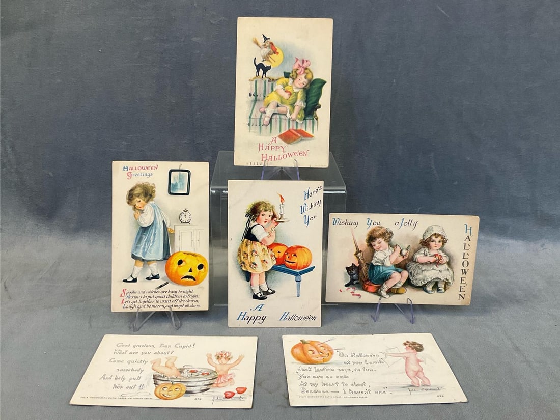 Halloween Postcards: Six circa 1920 Halloween postcards. Four published by Wolf & Company, and two Julia Woodward cards published by F.A. Owen Co.. Soft corners, foxing, circulated, otherwise good condition. Measures 5.5