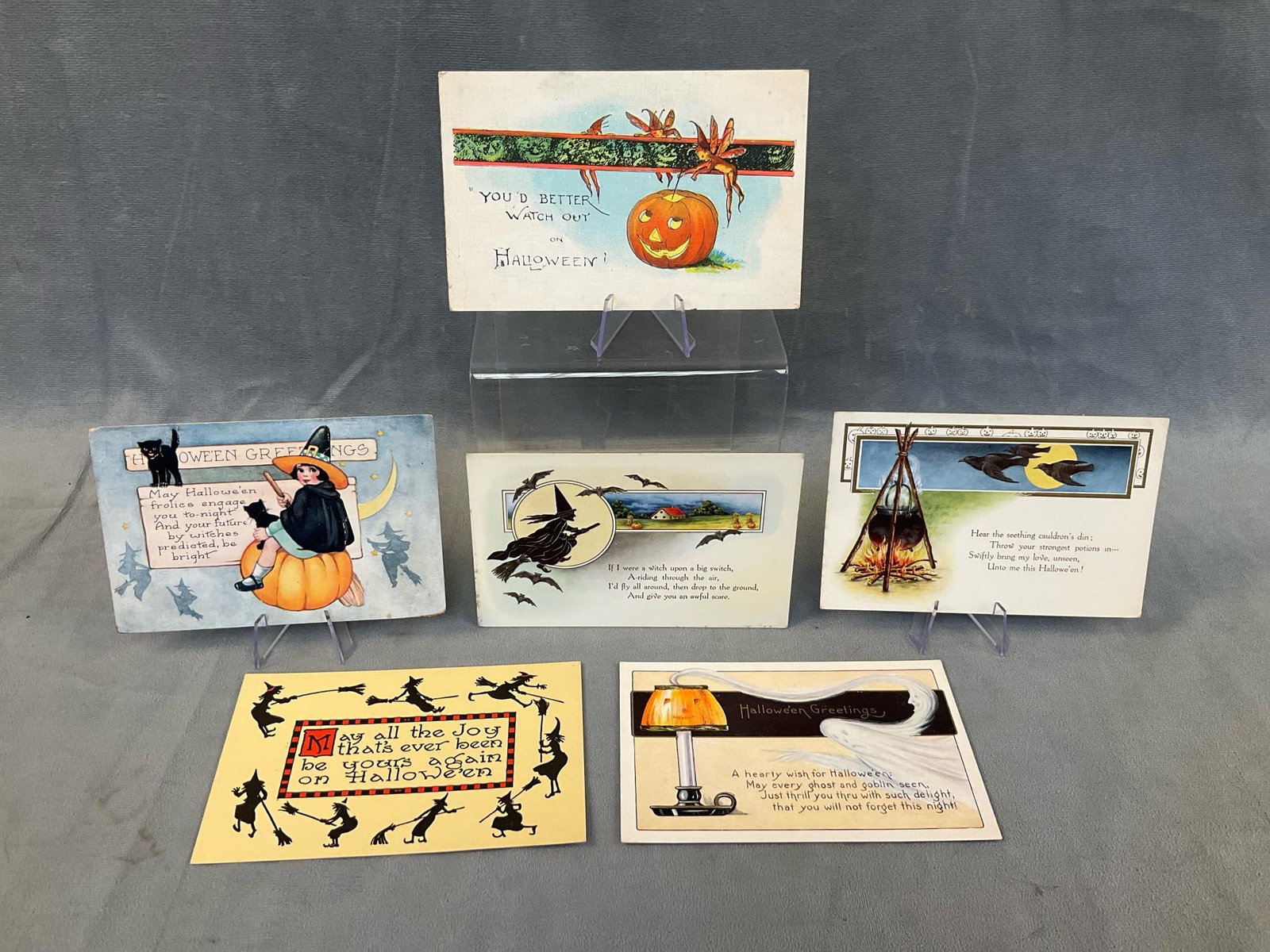Halloween Postcards: Six circa 1920 collectible Halloween postcards. One published by Bergman and three published by Whitney. Soft corners, foxing, and one circulated, otherwise good condition. Measures 5.5 inches wide x