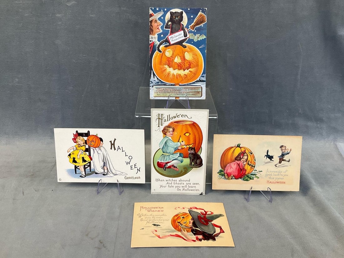 Halloween Cards: Five circa 1915 collectible Halloween postcards. "Halloween Precautions” with embossed black cat by Nash. Four Stecher cards with one illustrated by Margaret Evan's Price. Two circulated, soft