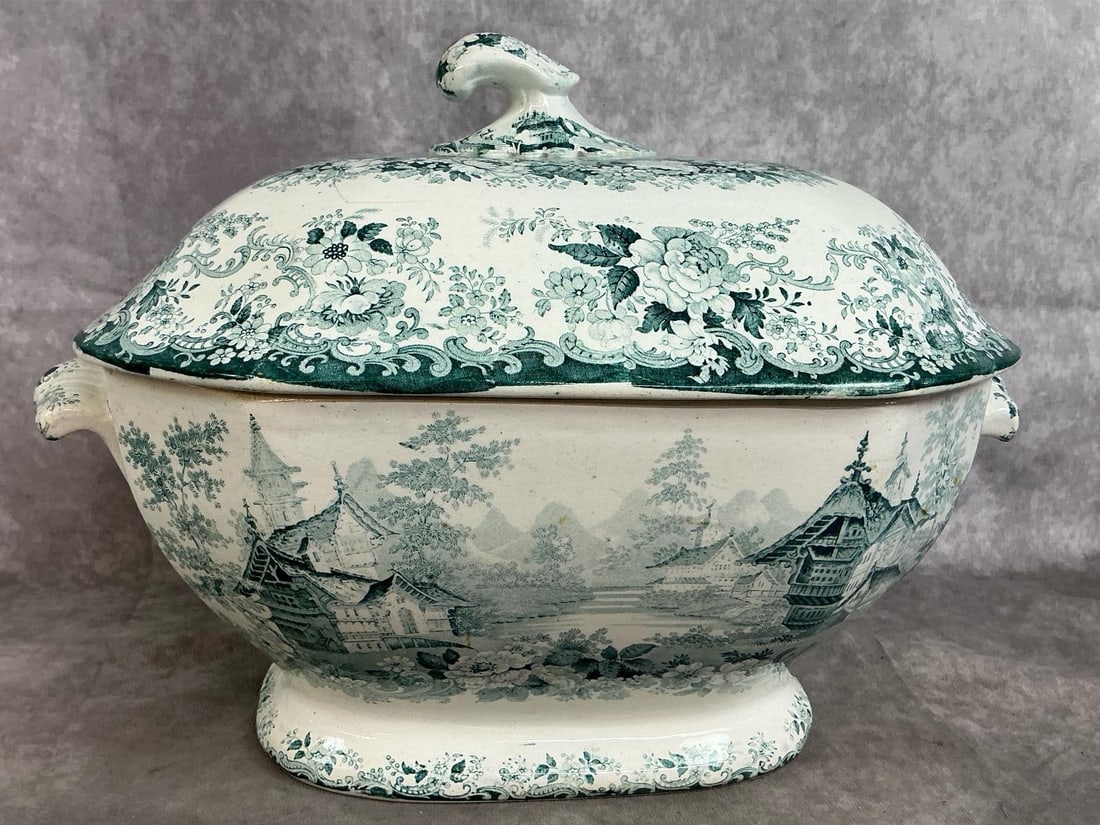 English Transferware Tureen: English Circa 1840 Chinoiserie Ceramic Transferware Tureen. Hairline crack in lid, otherwise in good condition. Measures 14 inches wide x 9 x 10 inches tall.