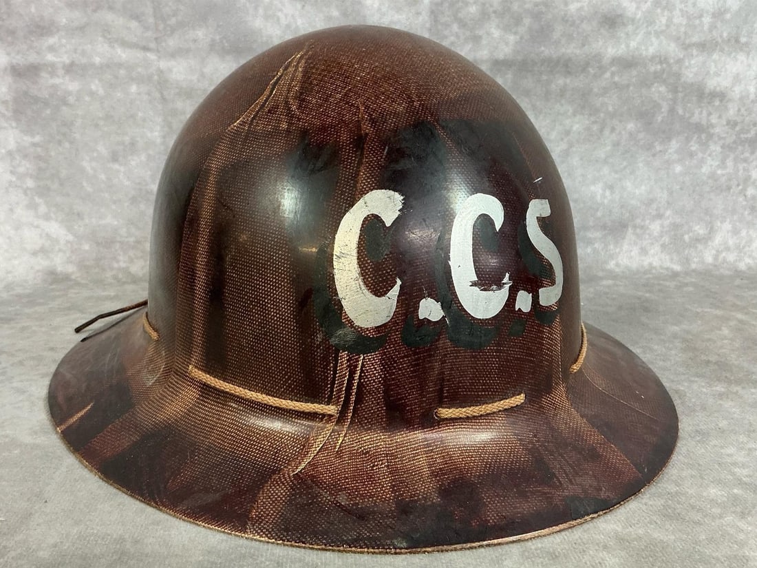 Mine Safety Hard Hat: Mid 1900's type K mine safety hard hat. Fiberglass full brim size 7 Skullguard hat marked "CCS". In good condition. Measures 10.5 inches wide x 12 x 6 inches tall.