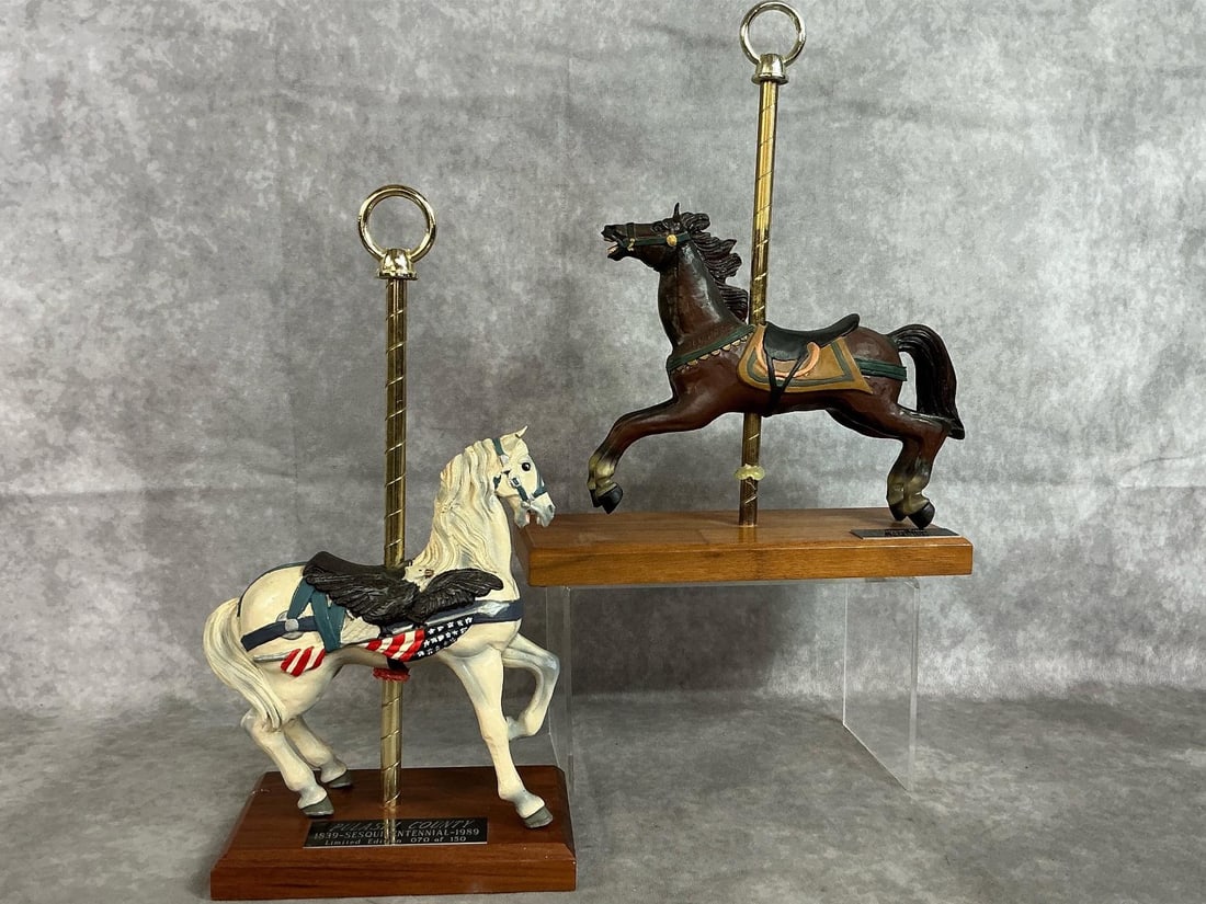 PJs Collectible Carousel Horses: Two late 1900's Carousel horses. Pulaski County Sesquicentennial limited edition 70/150 "Flag" horse and 1986 original brown horse. Flag horse has a chipped ear, other one in good condition. Brown