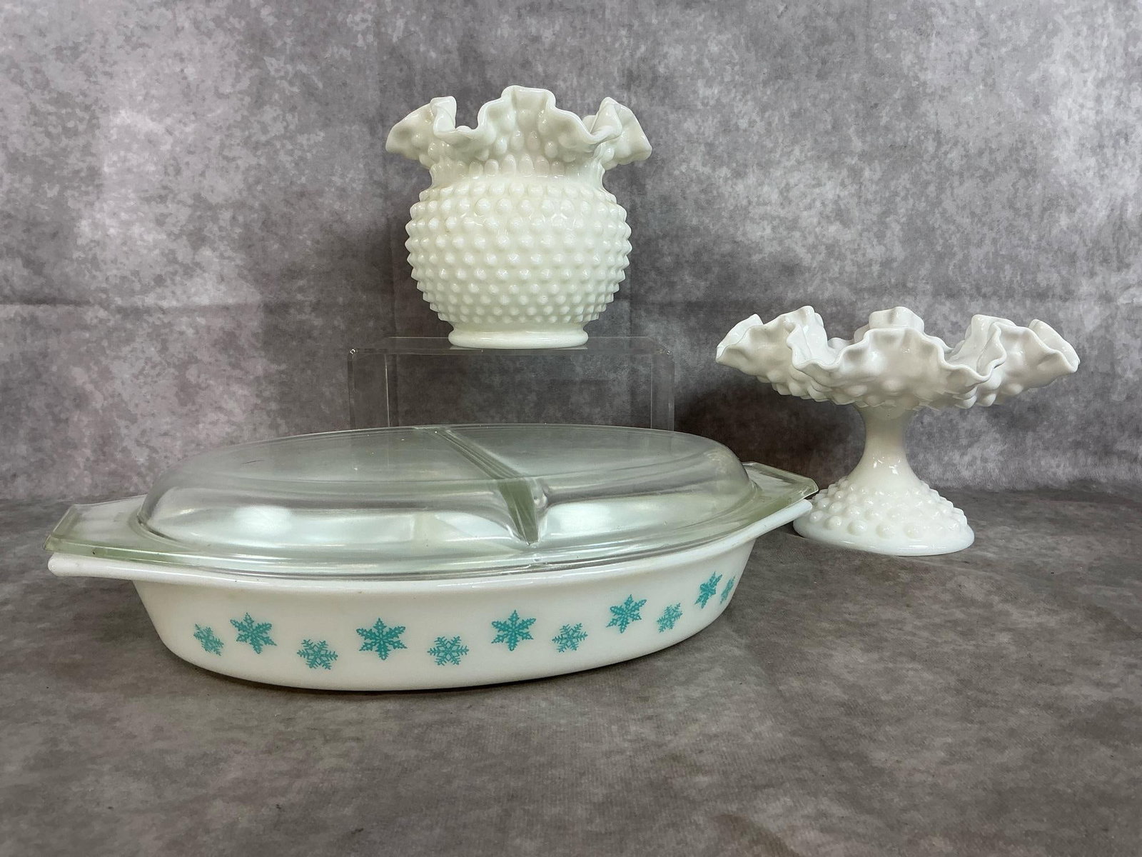 Pyrex Divided Dish & Fenton Vase and Compote: Three mid 1900's glass pieces. Pyrex snowflake pattern divided casserole dish with lid. Fenton hobnail milk glass ruffled edge vase and compote bowl. A few small marks, otherwise in good condition.