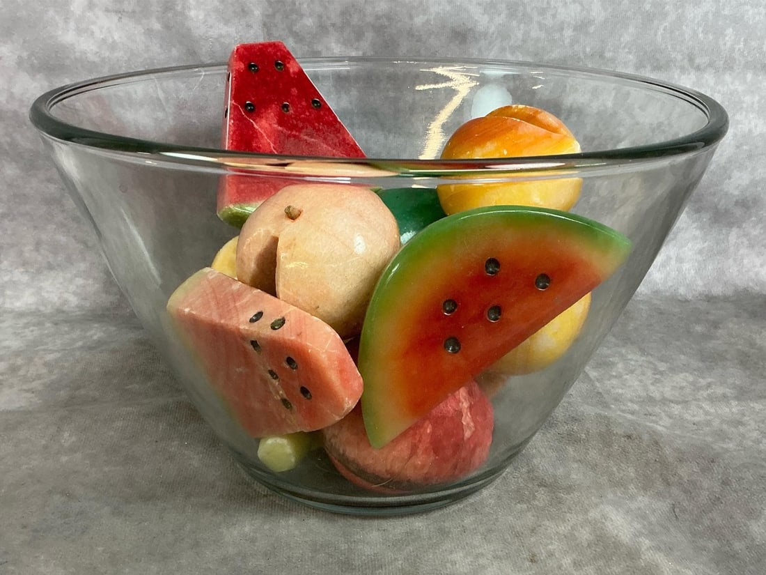 Glass Fruit & Bowl: Vintage glass bowl and eleven pieces of stone fruit. Variety of fruit carved from alabaster marble. Includes watermelon, pineapple, banana, pear, peaches and apples. Some small chips on fruit. Bowl