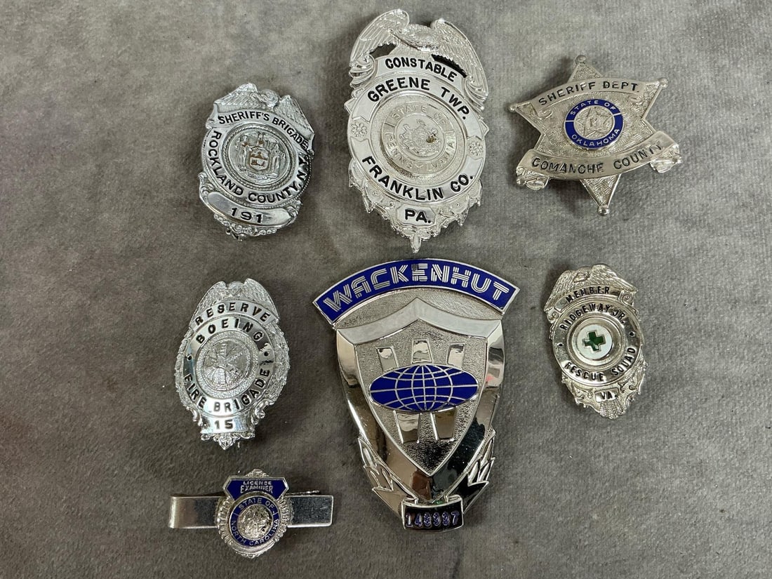 Collection of Badges: Six badges and a tie tack from late 1900's. Includes Sheriff's Dept badges from Comanche County in OK, and Rockland, NY County, and Franklin Co. PA Constable badge. Also, Wackenhut security, Boing