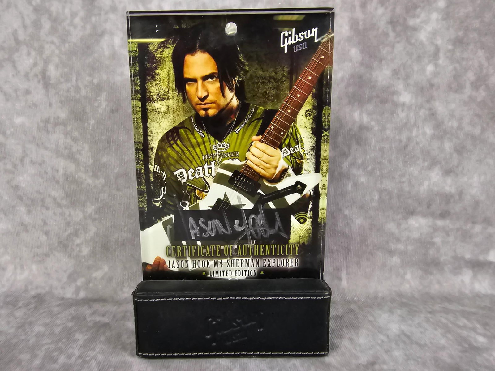 Jason Hook Autograph: Autographed COA for limited edition Jason Hook M4 Sherman Explorer guitar. Signed by Jason Hook and encased in acrylic, serial number 129021489. Guitar not included. Good condition. Measures 4.25