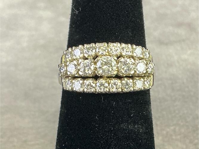 14kt White Gold Ring: 14kt white gold three rows of round cut diamonds often described as eternity bands. Size 6. In good condition, stamped and diamond tested. Total weight 3.4 dwt.