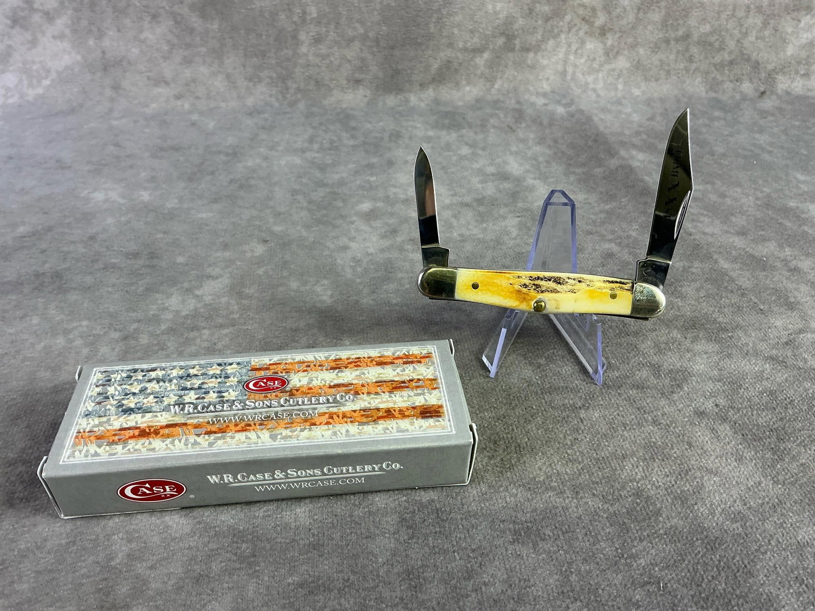 Case XX Knife: Case XX bonestag pocket knife. Muskrat, patterned 5208ss, with tight snap and original box. Box measures 4.5 wide x 1.75 inches tall.