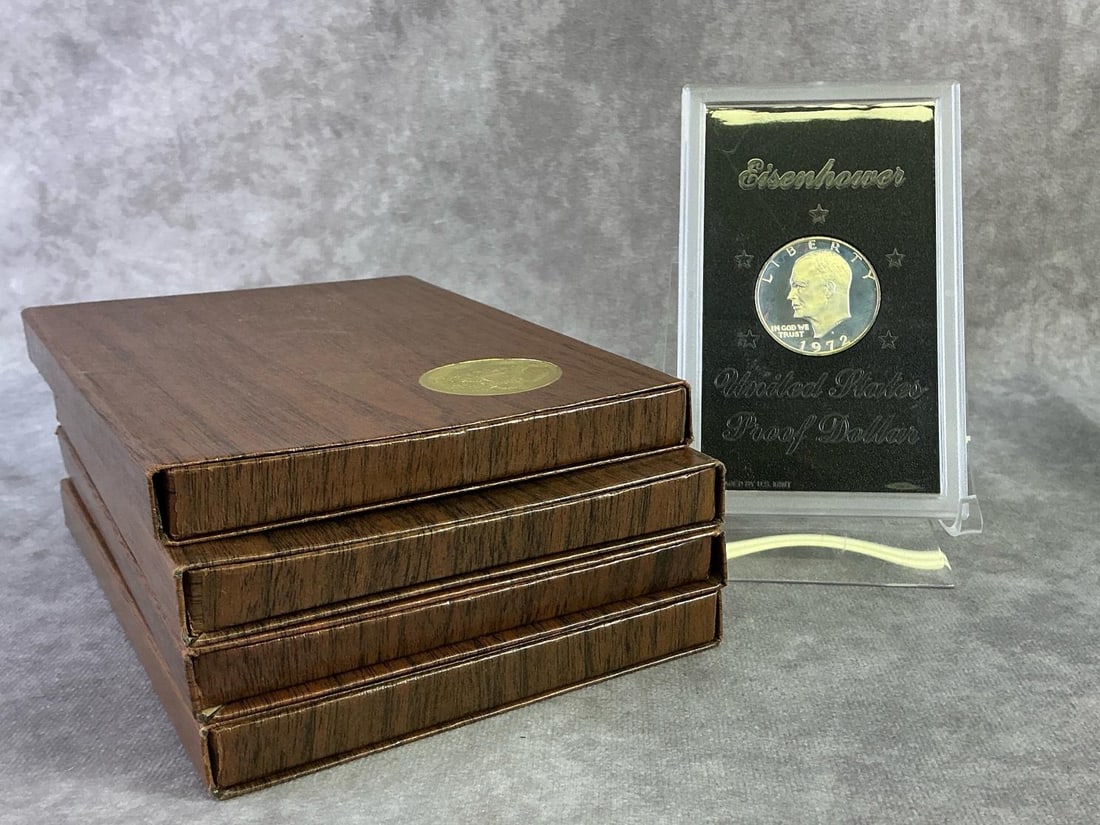 Brown Ike Coins: Four Eisenhower Proof Dollars, commonly called Brown Ike due to its original government packaging which are included. In good condition. Coins are struck in 40 percent silver and containing