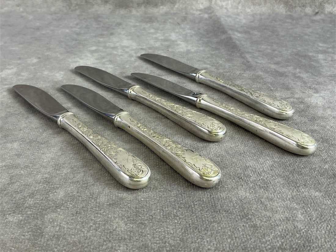 Sterling Butter Spreaders: Five sterling silver butter spreaders made by Kirk, handle sterling and blade stainless. All in good condition, stamped with oxidation present. Total weight 7.21 ozt.