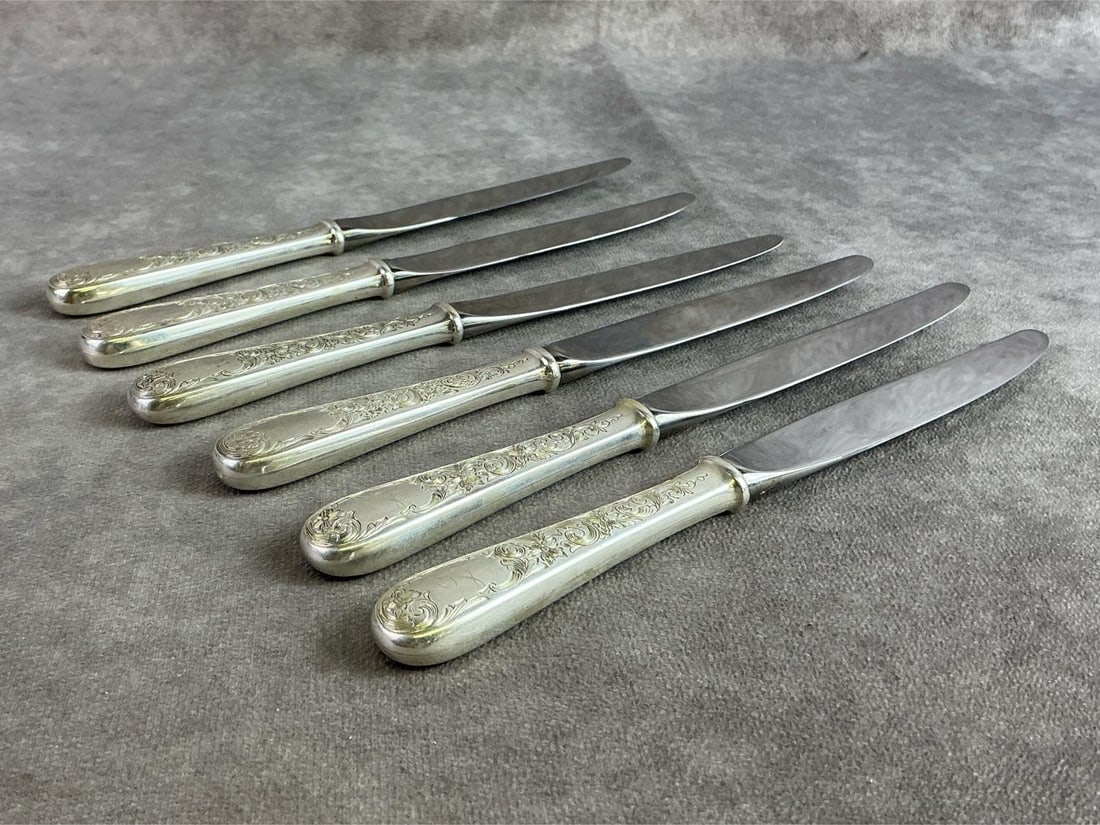 Sterling Butter Knives: Six sterling silver butter knives made by Kirk, handle sterling and blade stainless. All in good condition, stamped with oxidation present. Total weight 13.75 ozt.