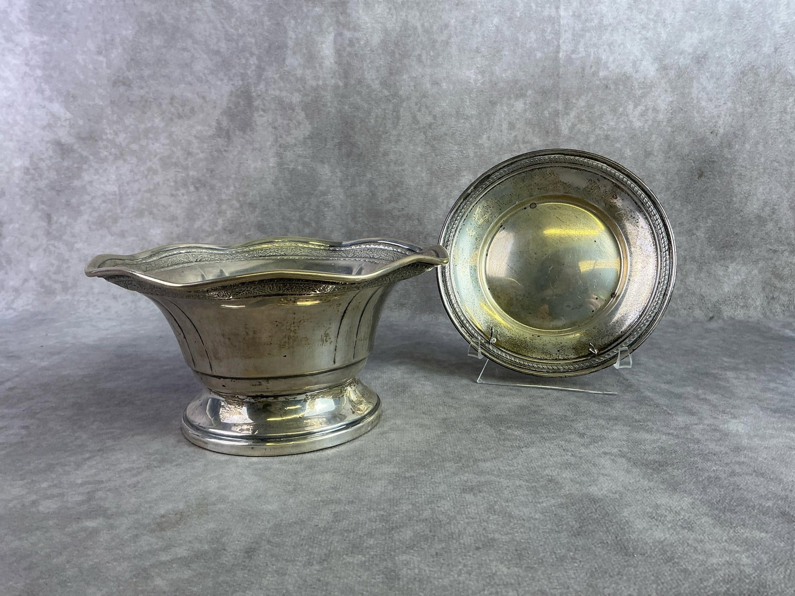 Sterling Silver Finds: Sterling Silver Pedestal bowl and Sterling silver platter. Both in good condition with oxidation present and stamped. Total weight 10.95 ozt.
