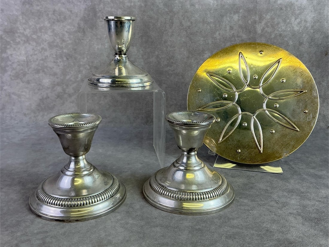 Sterling Silver Finds: Three Sterling Silver candlestick holders and sterling silver potholder. All in good condition with oxidation present and stamped. Total weight 33.76 ozt.