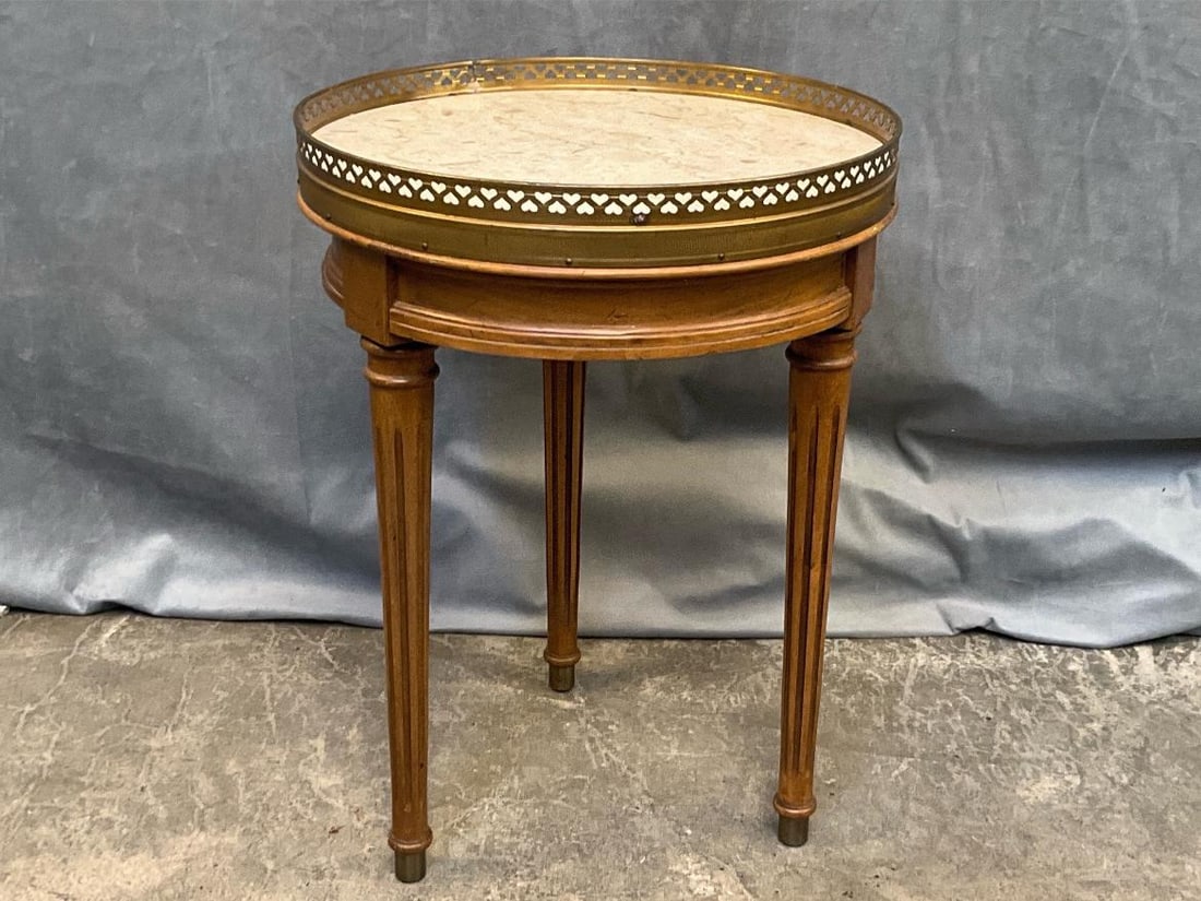 French Wine/Side Table: Mid-twentieth century Louis XVI Style Italian marble top side table with brass gallery and fluted legs. Brandt Furniture label to underside of table. Good condition. Measures 13.5 inches in diameter