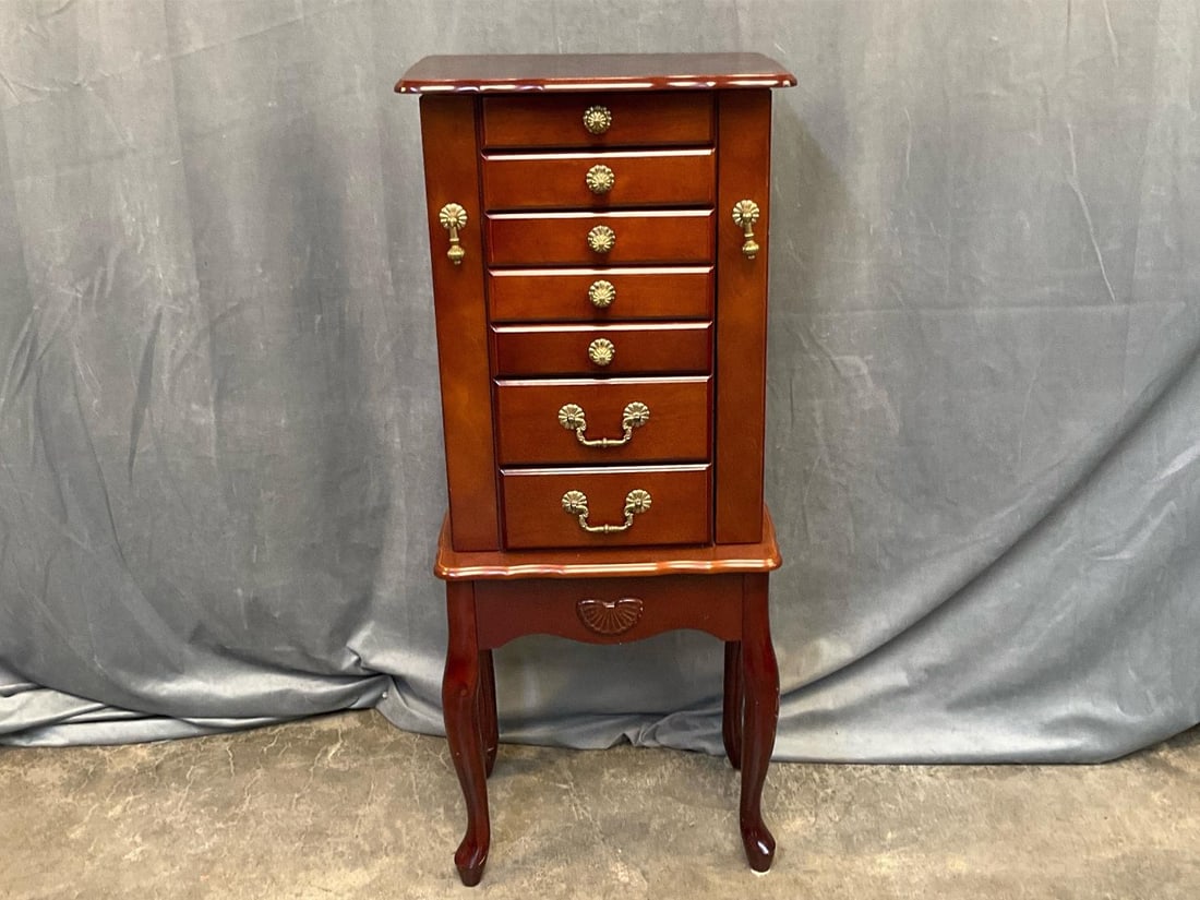 Jewelry Chest: Late twentieth century Queen Anne Style Jewelry Chest with two side doors, six velvet lined drawers, and lift top storage with mirror. Several scratches, otherwise good condition. Measures 16 inches