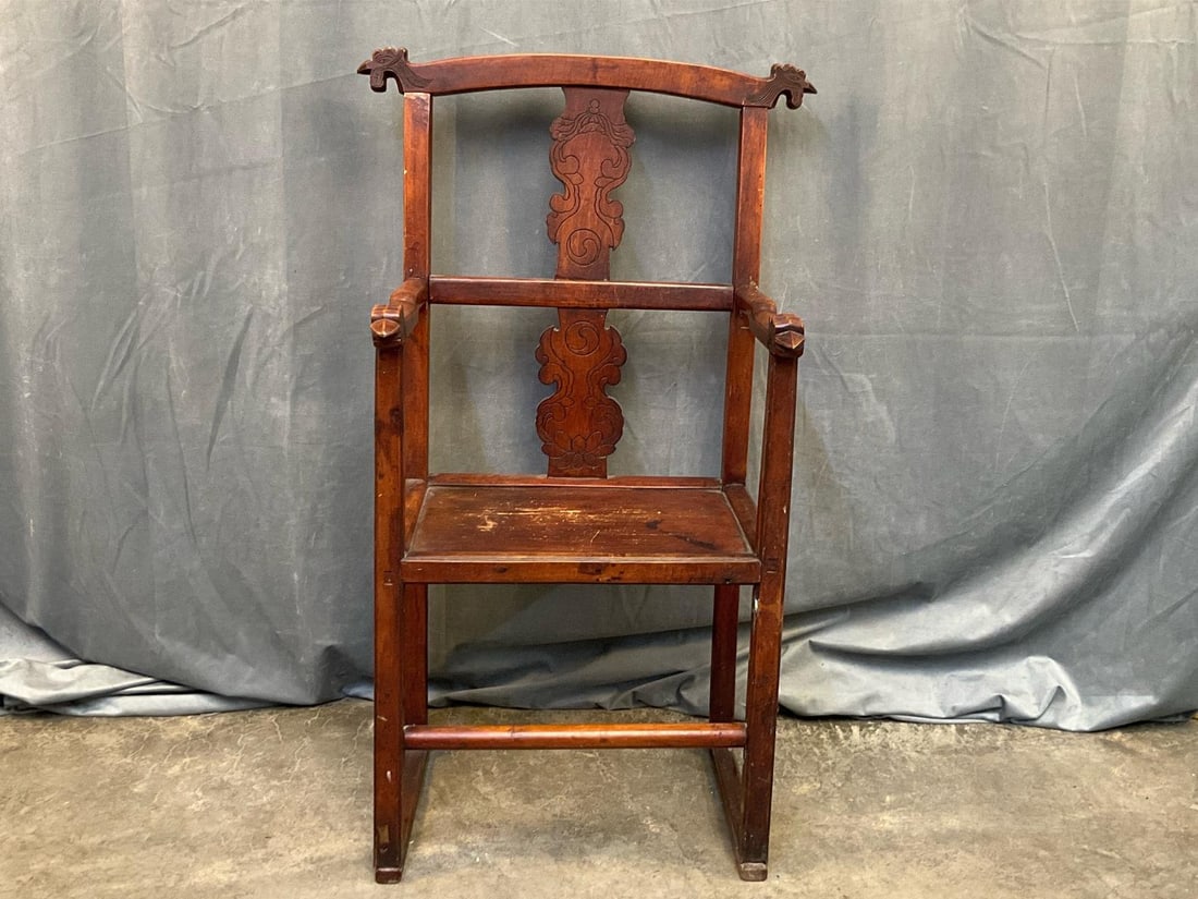 Chinese Qing Dynasty Chair: Nineteenth Century Qing Dynasty Guanmaoyi Chair (official's hat armchair). Cedar and elm wood with peg and tenon construction, chicken carved arm handholds and crest rail projections, and carved