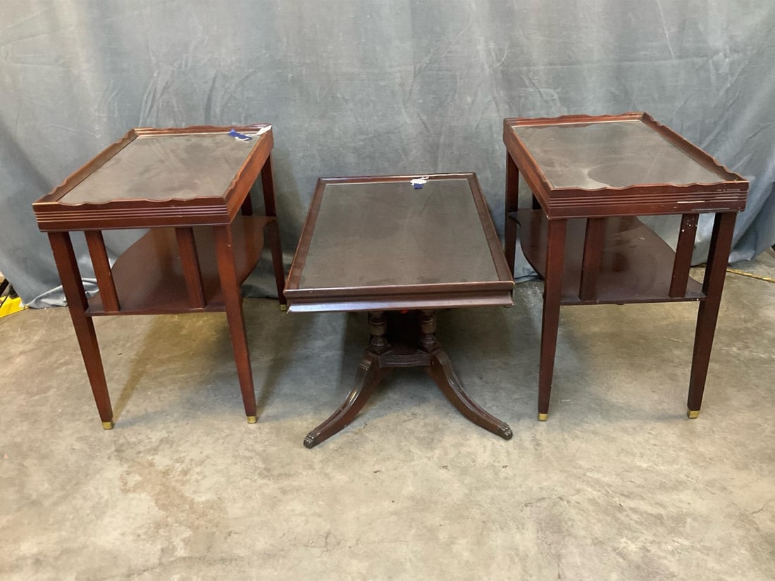 End Tables: Three mid-20th century Mahogany End/Coffee Tables with glass tops and lower shelves (two matching). Good condition. Table with saber legs measures 30 inches wide x 18 x 15.5 inches tall.